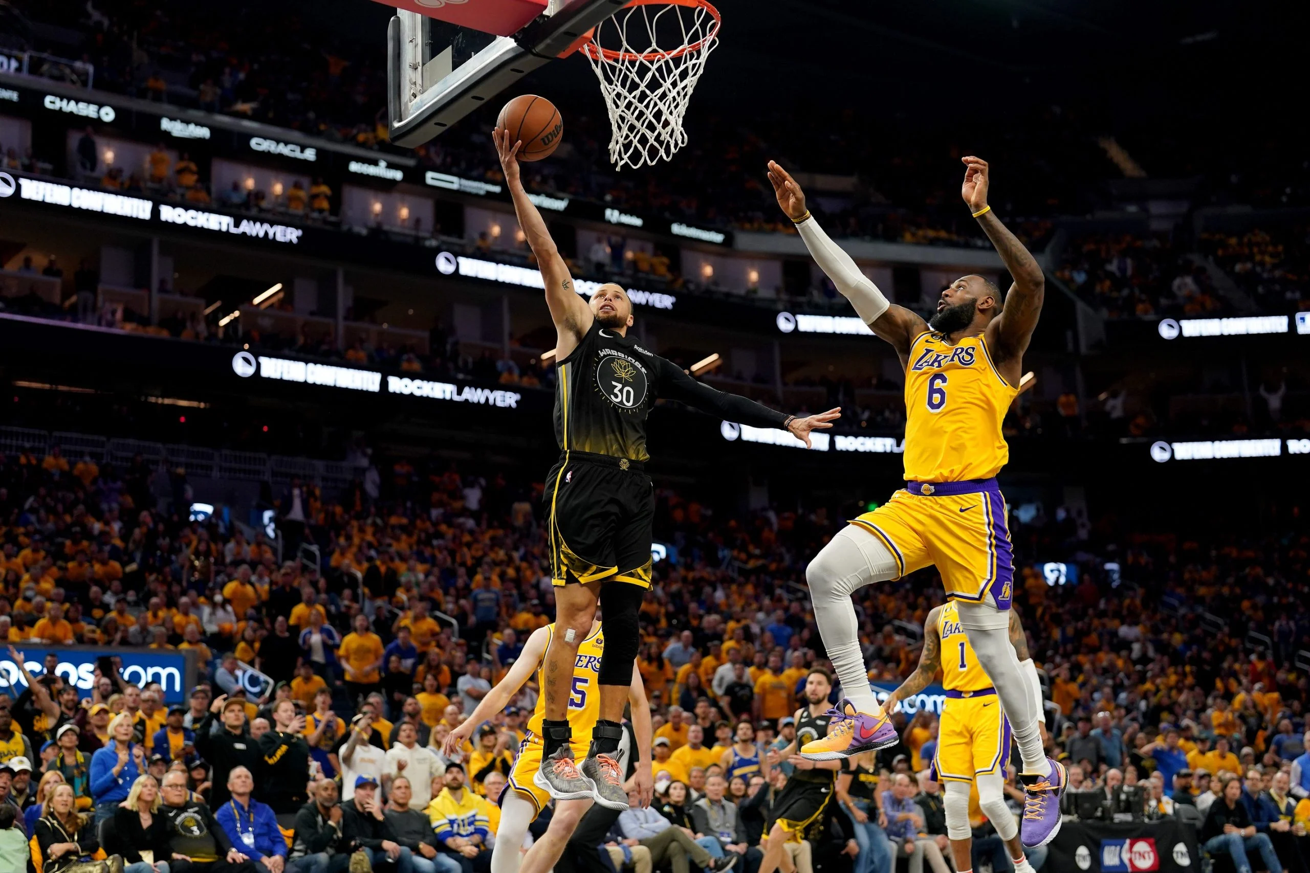 Stephen Curry laying it over LeBron James